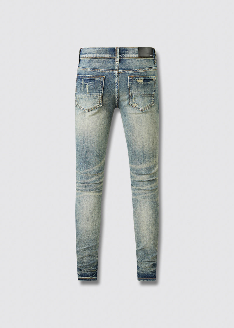 Jeans Azul Lavado con Roturas y Parches de Contraste