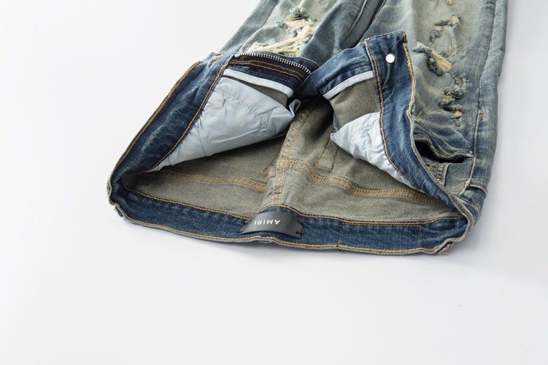 Jeans Azul Lavado con Roturas y Parches de Contraste
