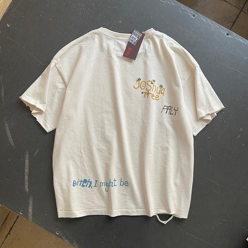 Camiseta gráfica crema con desgastes / Camiseta estilo retro con frases y dibujos
