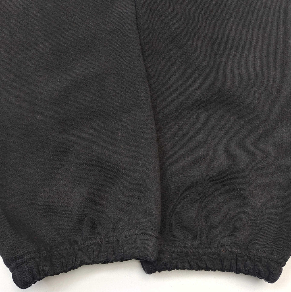 Pantalones Sp5der – Logo Curvo Gris