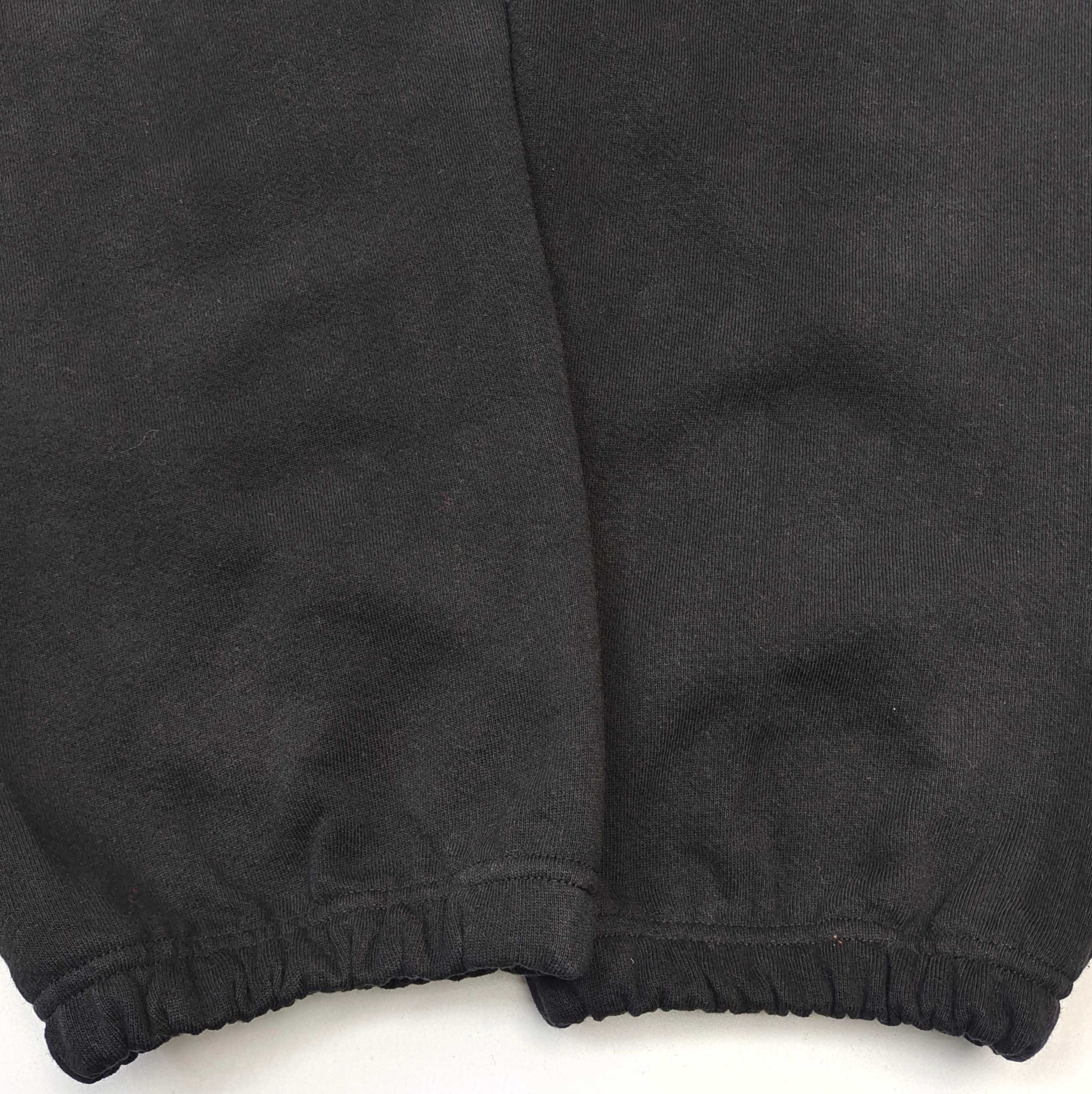Pantalones Sp5der – Logo Curvo Gris
