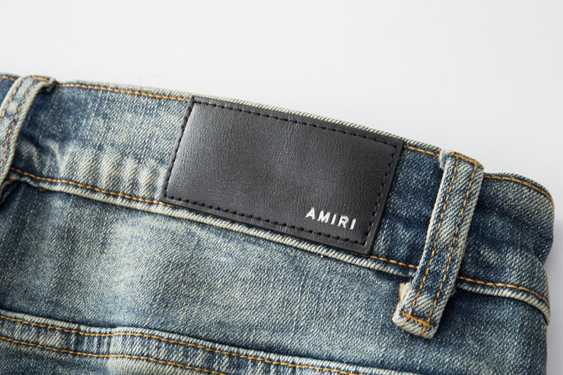 Jeans Azul Lavado con Roturas y Parches de Contraste