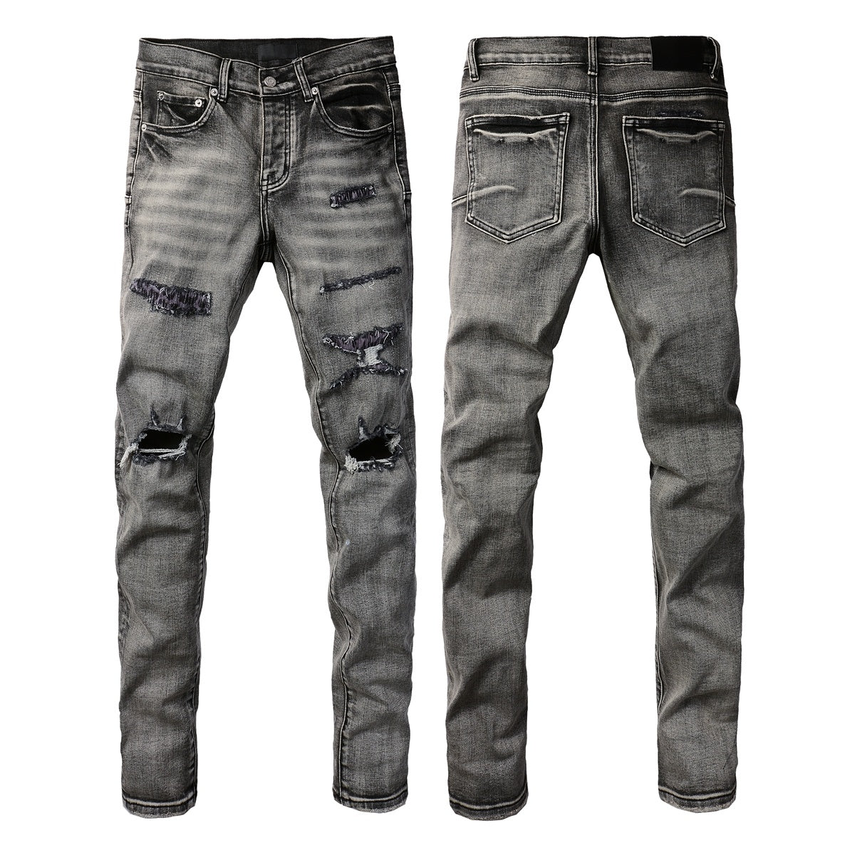 Jeans de mezclilla en tono gris lavado oscuro, acabado desgastado estilo vintage.