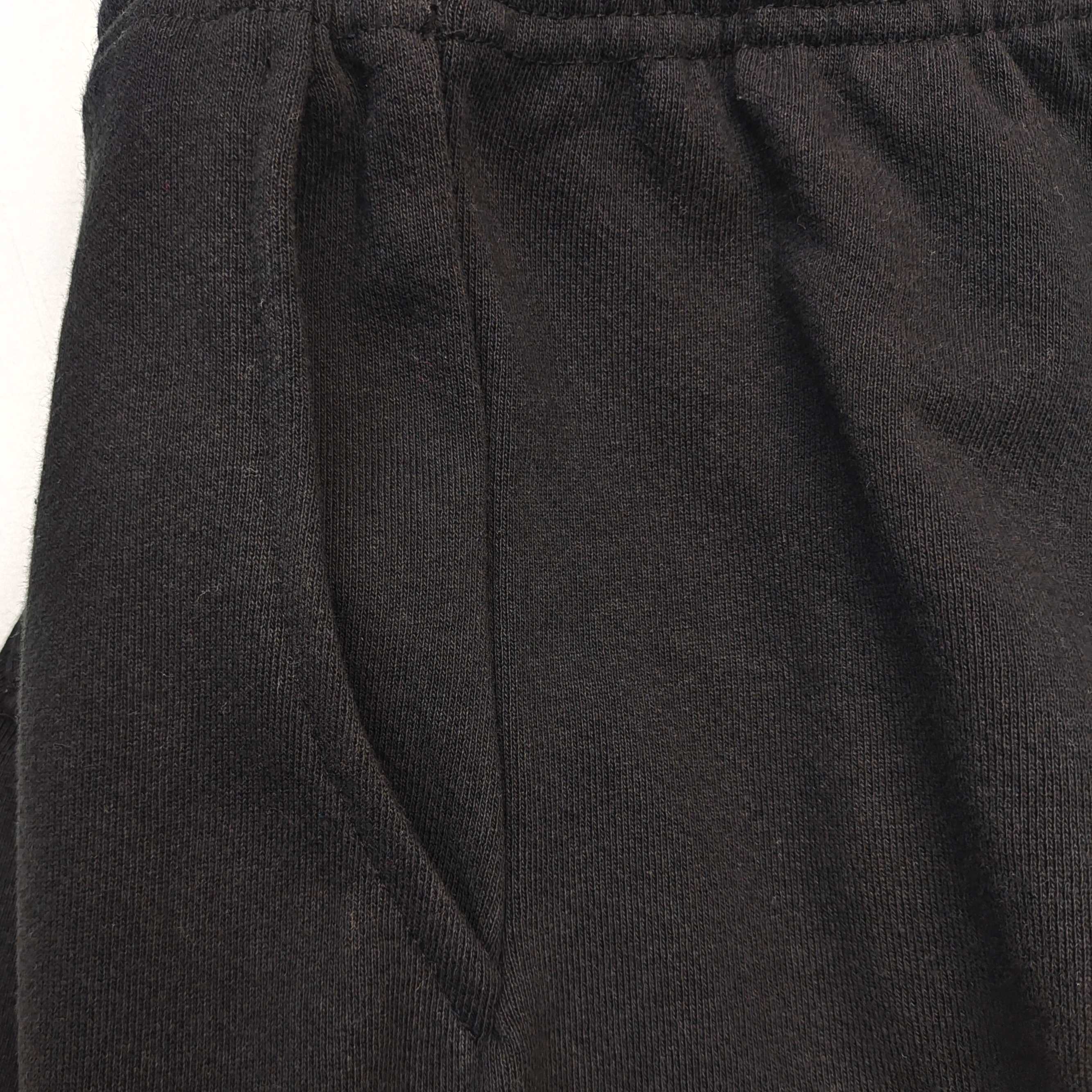 Pantalones Sp5der – Logo Curvo Gris